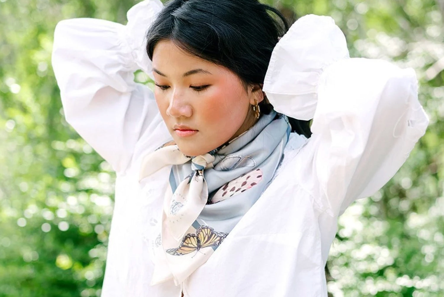 Woman wearing patterned scarf 
