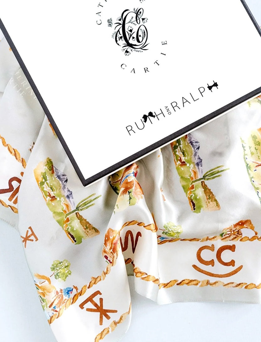 Scarf with decorative patterns and initials, featuring the brand 'Ruth & Ralph'.